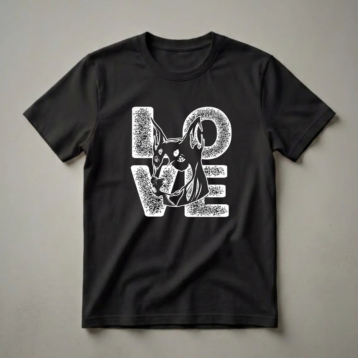 Black graphic t-shirt featuring the word 'LOVE' in a distressed white stencil font, with the head of a Doberman Pinscher replacing the letter 'O'.