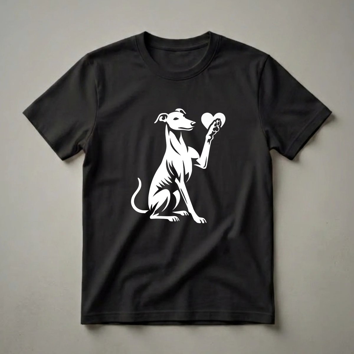 White graphic of a whippet dog sitting and holding a heart with its paw, on a black t-shirt.