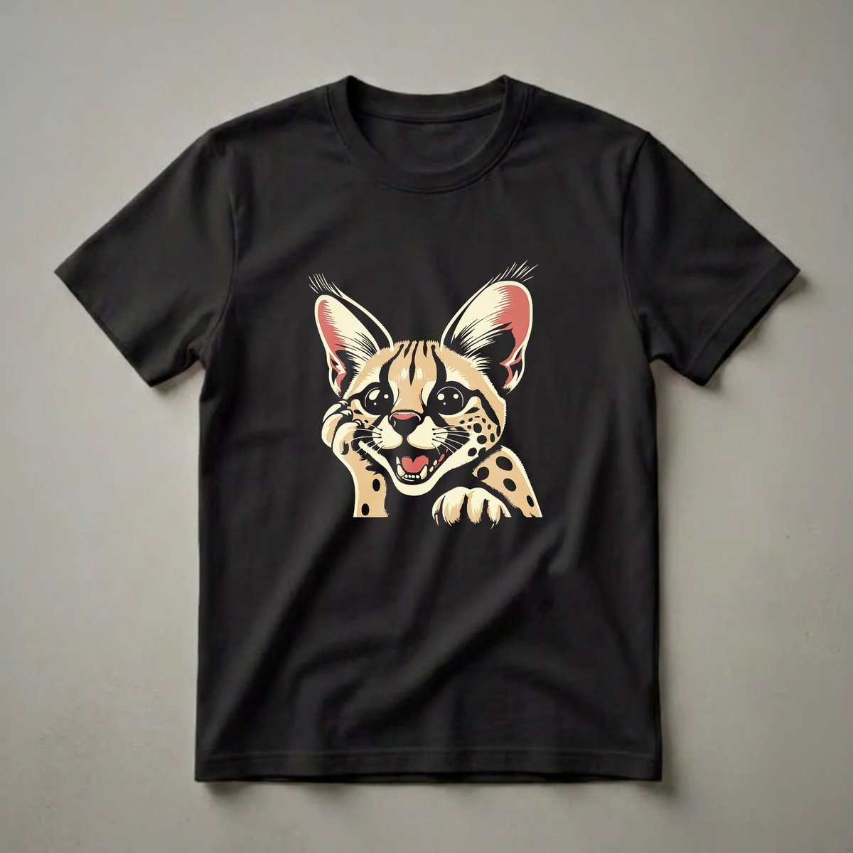 Black t-shirt featuring a retro graphic of a serval cat's face with large ears, big eyes, and an open mouth, rendered in cream, red, and black.