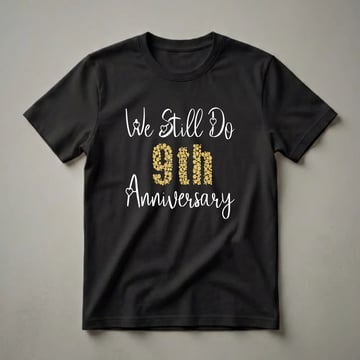 Black t-shirt with white script text 'We Still Do' and 'Anniversary', with the number '9th' in the center filled with gold bubbles.