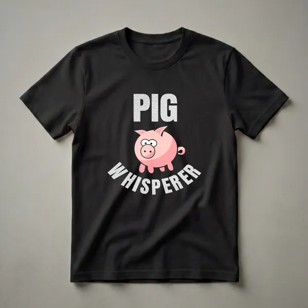 Black t-shirt with a pink cartoon pig graphic and distressed white text that reads 'PIG WHISPERER'.
