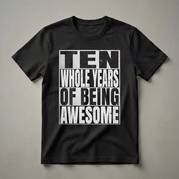 Black and white graphic t-shirt with distressed lettering that reads 'TEN WHOLE YEARS OF BEING eye-catching' in stacked lines.