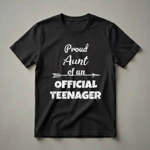 Black t-shirt with distressed white text that reads 'Proud Aunt of an Official Teenager' with an arrow graphic.