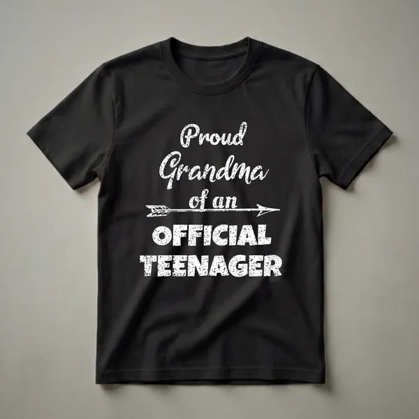 Black t-shirt with white distressed text that reads 'Proud Grandma of an Official Teenager' with an arrow graphic.