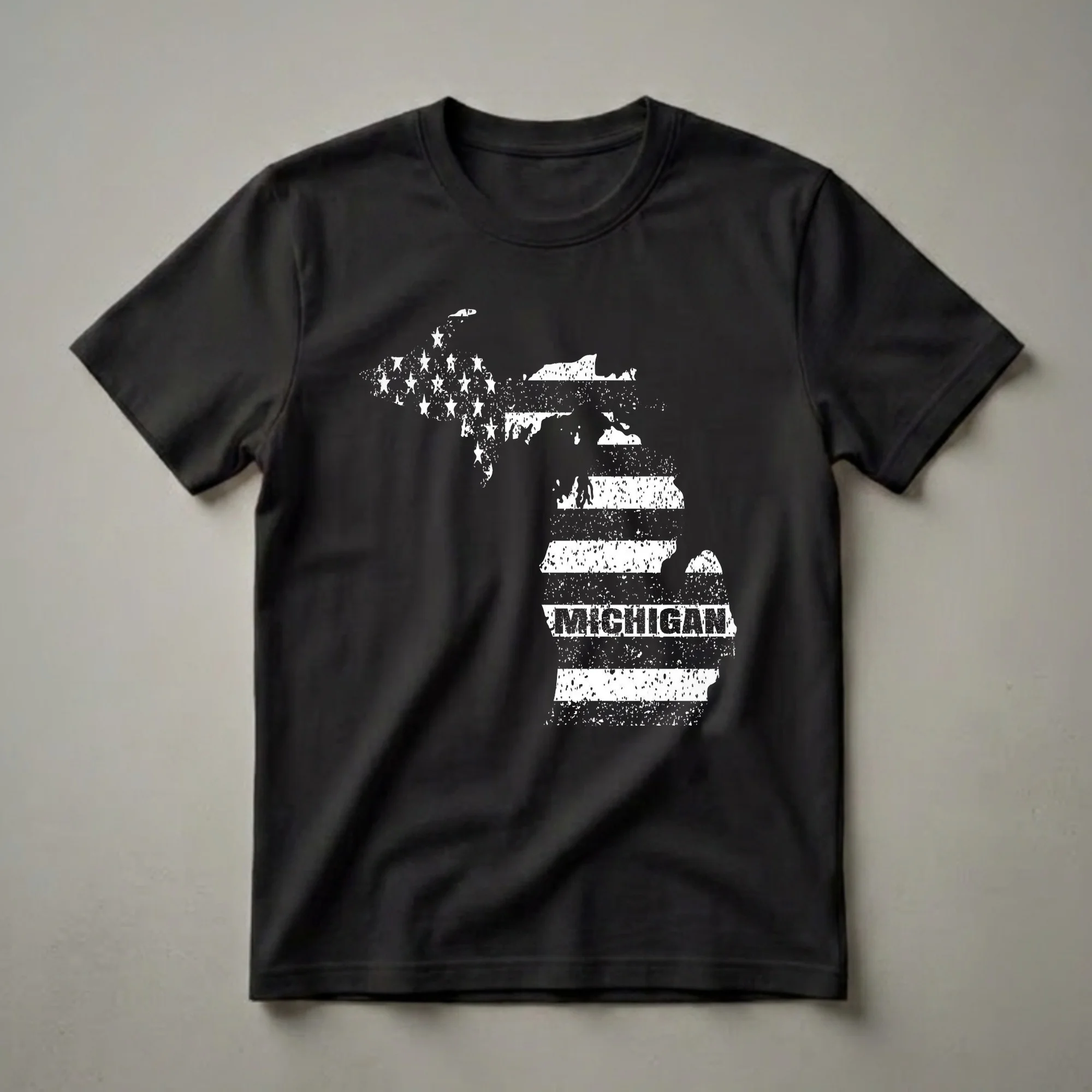 Black t-shirt featuring the outline of Michigan filled with a distressed American flag design, including stars and stripes, with the word MICHIGAN printed across the stripes.