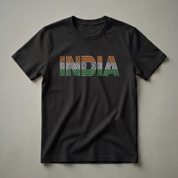 Black t-shirt with the word INDIA in distressed, retro lettering filled with the colors and pattern of the Indian national flag, including the Ashoka Chakra.