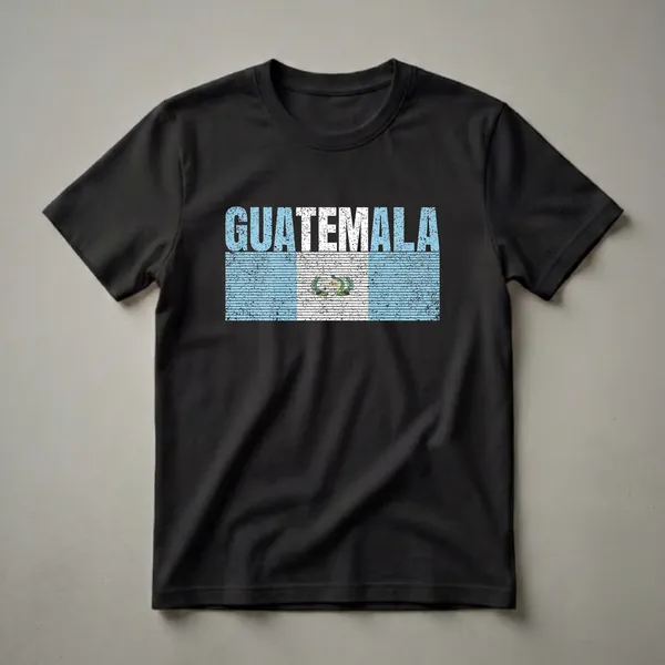 Black t-shirt with the word GUATEMALA in distressed blue and white letters above a distressed Guatemalan flag featuring a Quetzal bird emblem.