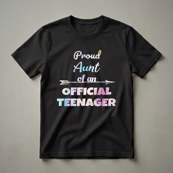 Black t-shirt with the text 'Proud Aunt of an Official Teenager' in watercolor fill, featuring a decorative arrow graphic.