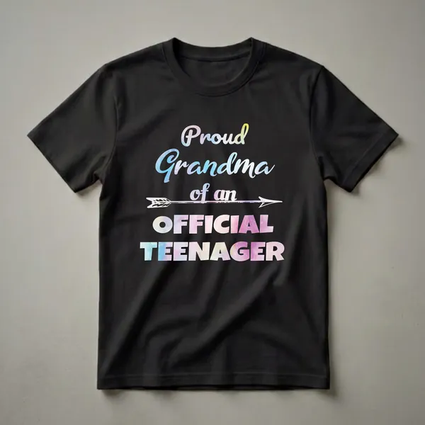 Black t-shirt with watercolor text that reads 'Proud Grandma of an Official Teenager' in a playful font with an arrow graphic.
