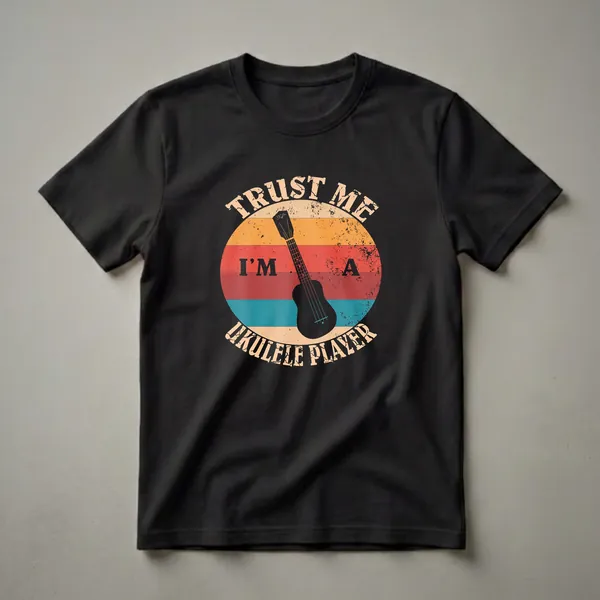 Black t-shirt with a retro sunset graphic featuring a black ukulele silhouette and distressed text that reads 'Trust Me I'm A Ukulele Player'.