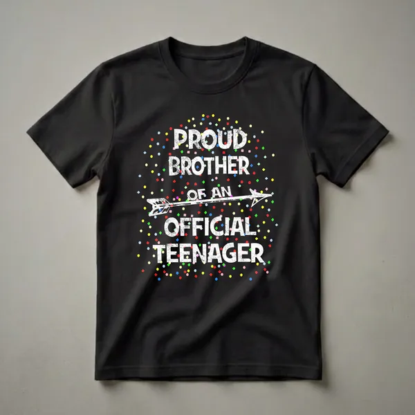 Black t-shirt with distressed white text that reads 'Proud Brother of an Official Teenager' and a white arrow graphic, surrounded by colorful confetti.