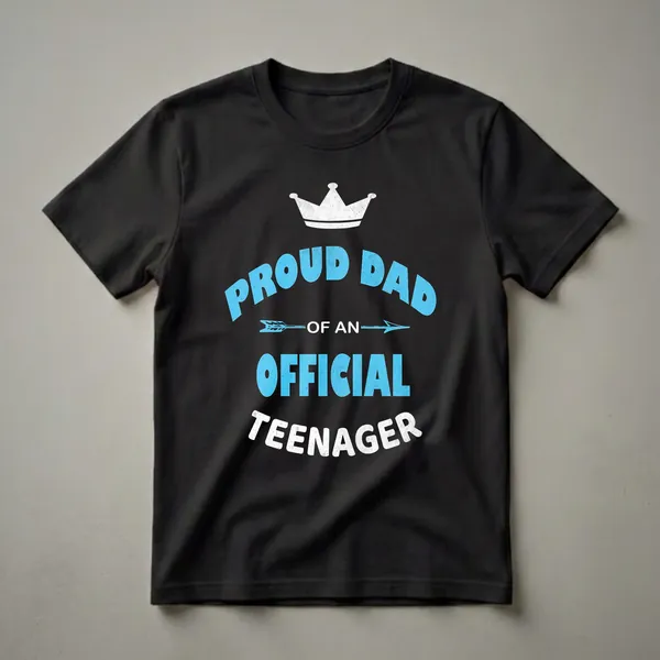 Black t-shirt with distressed blue and white text that reads 'Proud Dad of an Official Teenager' with a crown and arrow graphic.