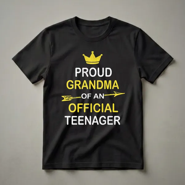 Black t-shirt with distressed yellow and white text that reads 'Proud Grandma of an Official Teenager', featuring a yellow crown and arrow graphic.