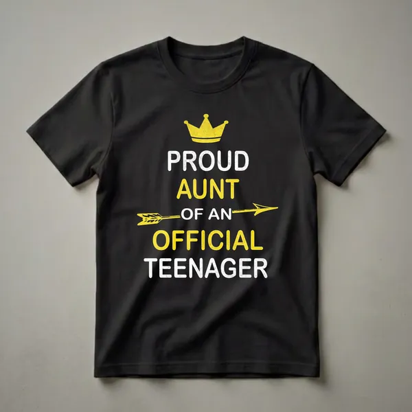 Black t-shirt with distressed white and yellow text that reads 'Proud Aunt of an Official Teenager', featuring a yellow crown and arrow graphic.