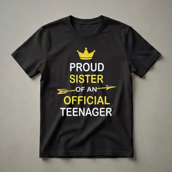 Black t-shirt with distressed white and yellow text that reads 'Proud Sister of an Official Teenager,' featuring a yellow crown and arrow graphic.