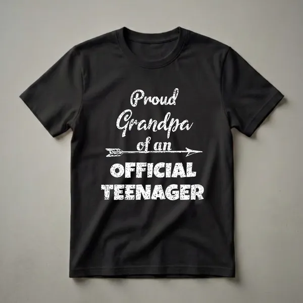 Black t-shirt with white distressed text that reads 'Proud Grandpa of an Official Teenager' with an arrow graphic.