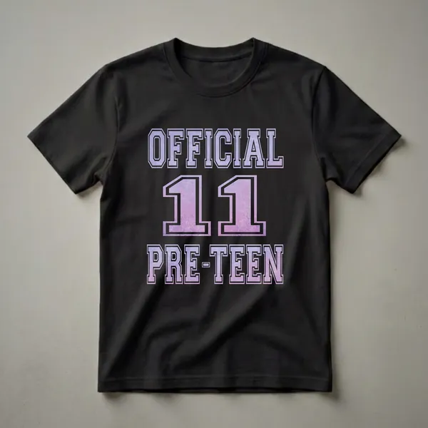 Black t-shirt with 'OFFICIAL 11 PRE-TEEN' graphic in a purple and pink gradient collegiate font with a distressed texture.