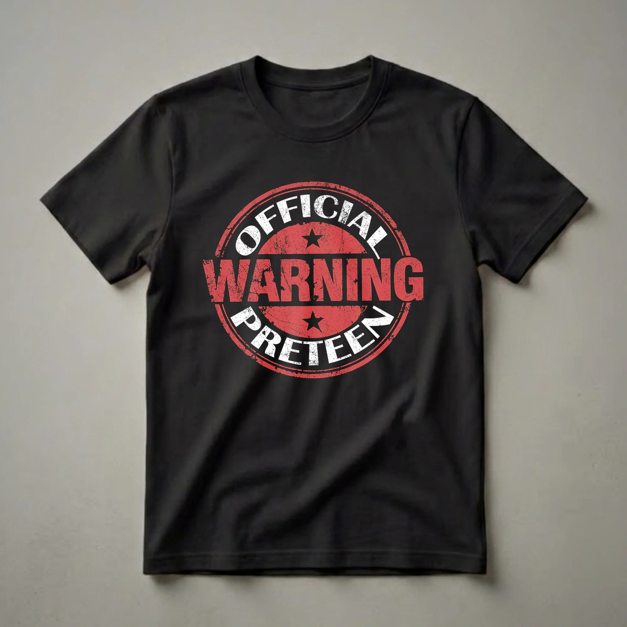 Black t-shirt with a distressed red and white circular graphic that reads 'OFFICIAL WARNING PRETEEN' with two black stars.