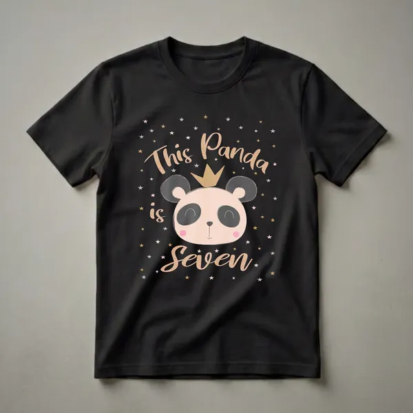 Black t-shirt with a graphic of a panda wearing a gold crown, surrounded by colorful stars, and the text 'This Panda is Seven' in gold and pink.