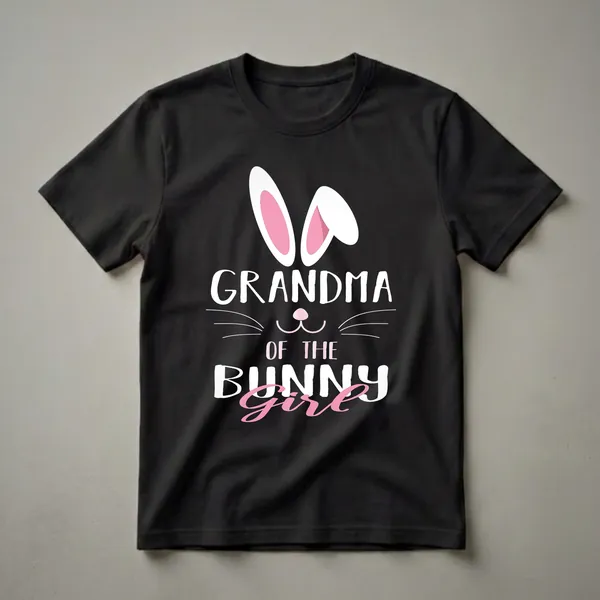 Black t-shirt featuring white bunny ears with pink insides, a pink bunny nose and whiskers, and the text 'GRANDMA OF THE BUNNY Girl' in white and pink lettering.