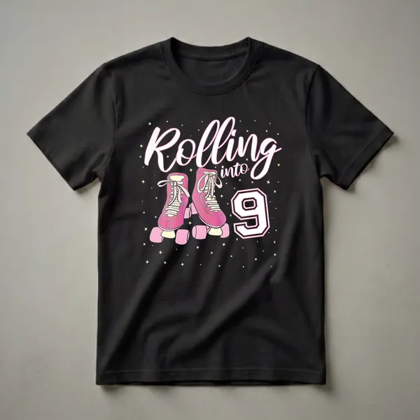 Black t-shirt featuring pink roller skates, the words "Rolling into" in white script, and a large white number "9" with pink and black trim, surrounded by yellow stars.