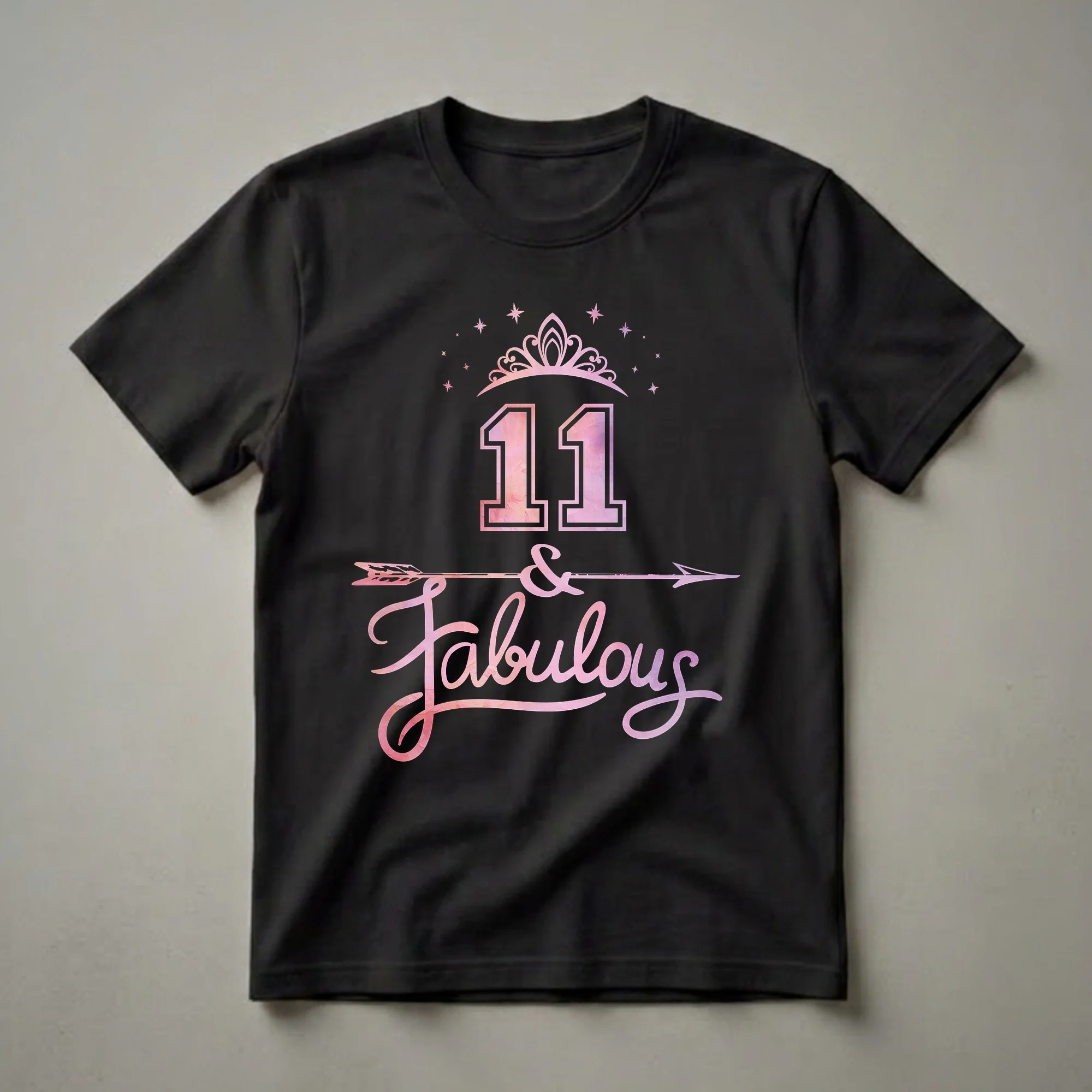 Black t-shirt featuring the number 11 with a pink and purple watercolor fill, a tiara, stars, an arrow, and the words 'and Fabulous' in a script font.