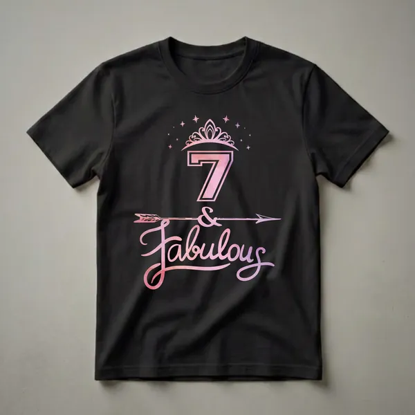 A black t-shirt graphic featuring the number 7 with a pink and purple watercolor fill, a tiara, stars, an arrow, and the word 'Fabulous' in a script font.