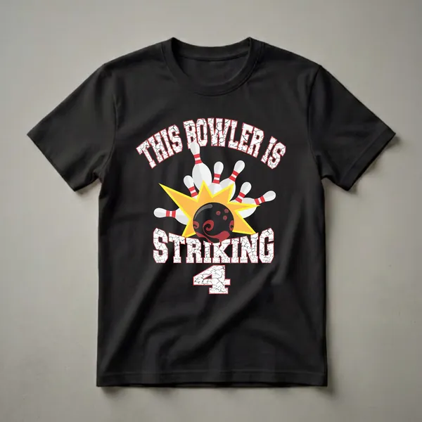 Black graphic t-shirt with white distressed text 'THIS BOWLER IS STRIKING' and a large number '4', featuring a bowling ball hitting white pins with red stripes against a yellow starburst.