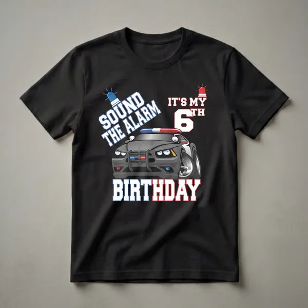 Black t-shirt featuring a cartoon police car with flashing blue and red lights, and bold text that reads "SOUND THE ALARM IT'S MY 6TH BIRTHDAY".