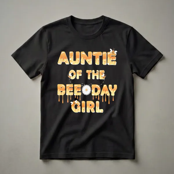 Black t-shirt with the words 'Auntie Of The Bee Day Girl' in large, dripping orange letters filled with honeycomb patterns and small bees.