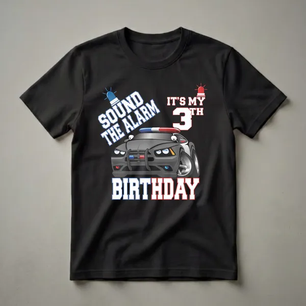 Black t-shirt with a cartoon police car graphic. The text "SOUND THE ALARM" and "IT'S MY 3rd BIRTHDAY" is displayed in bold white and red lettering, with blue and red siren lights on the car and above the text.