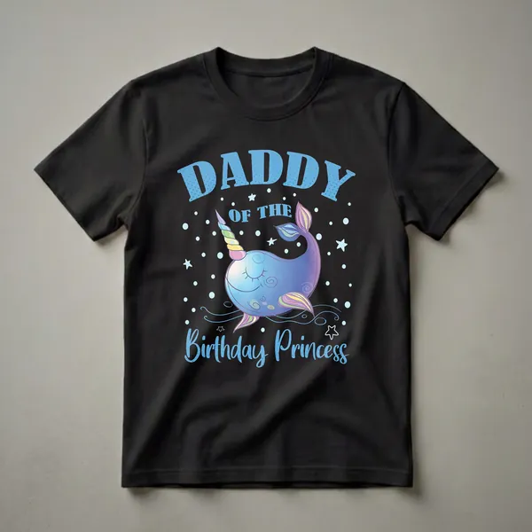Black t-shirt with blue text "DADDY OF THE BIRTHDAY PRINCESS" and a cartoon narwhal with a unicorn horn and rainbow fins, surrounded by stars and polka dots.