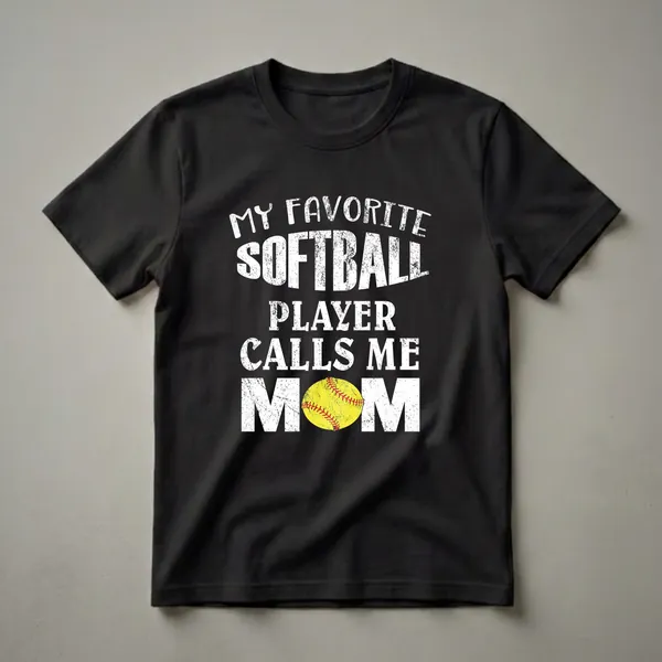 Black t-shirt with white distressed text that reads "My Favorite Softball Player Calls Me Mom" and a graphic of a yellow softball with red stitching.