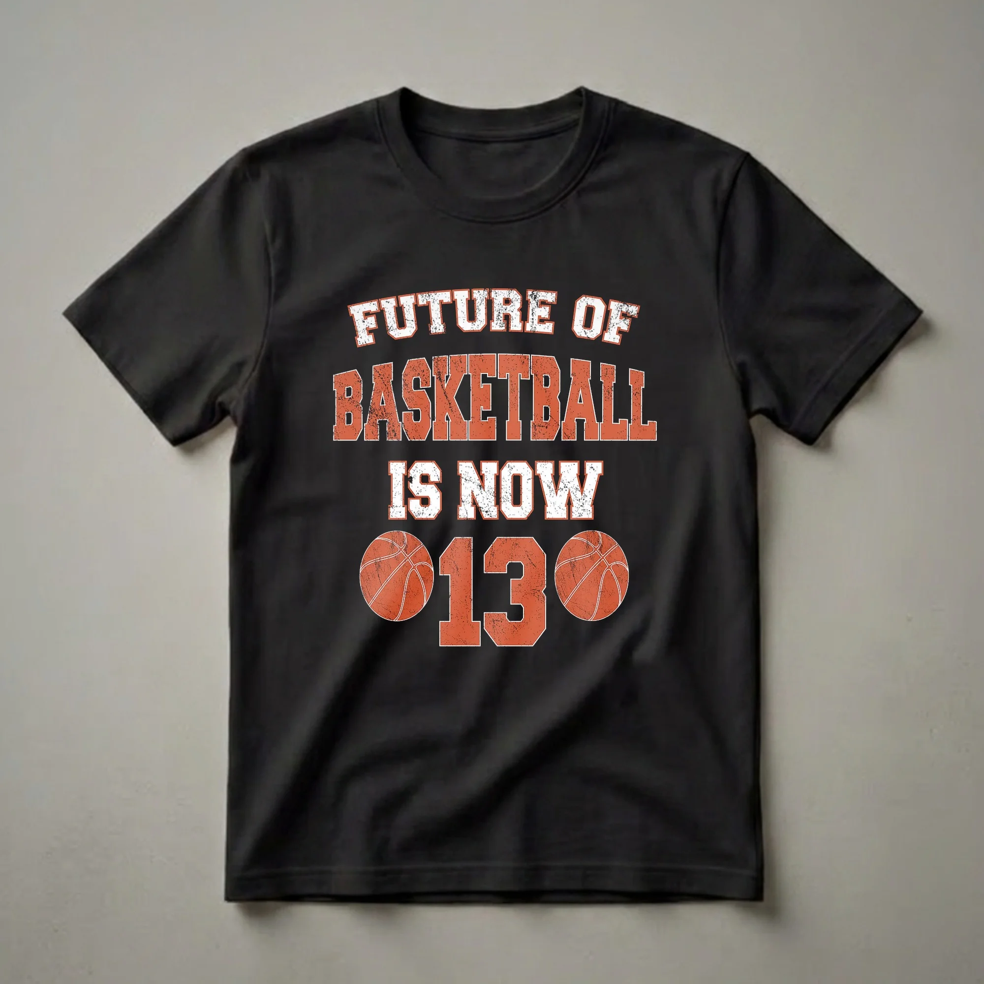 Black t-shirt with distressed white and orange text reading 'FUTURE OF BASKETBALL IS NOW' above a large distressed orange number '13' flanked by two basketball graphics.