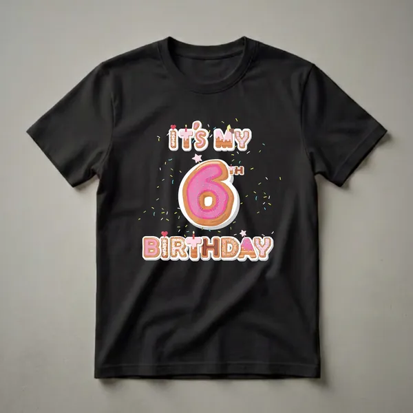 Black t-shirt with "It's My 6th Birthday" written in donut-shaped letters, a large pink donut number 6, and colorful sprinkles.