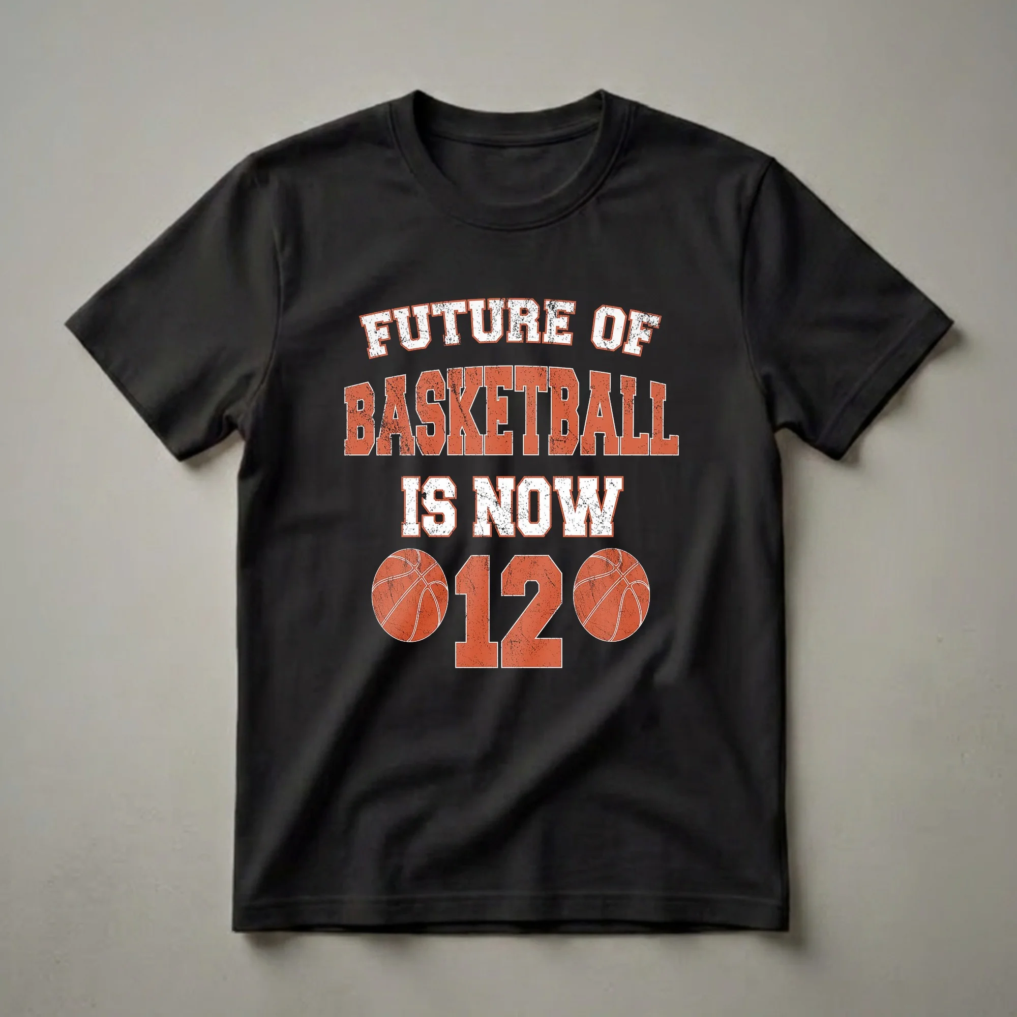 Black t-shirt with distressed white and orange text reading 'FUTURE OF BASKETBALL IS NOW' above a large distressed orange number '12' flanked by two distressed orange basketballs.
