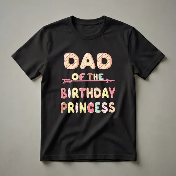 Black t-shirt with the text 'DAD OF THE BIRTHDAY PRINCESS' written in colorful donut-shaped letters, with a pink arrow graphic.