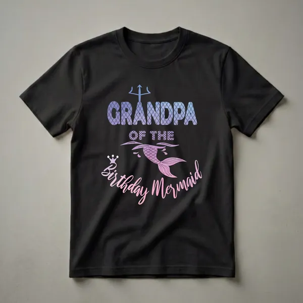 Black t-shirt with the text "Grandpa Of The Birthday Mermaid" in gradient purple and pink, featuring a mermaid tail, crown, and trident graphic.