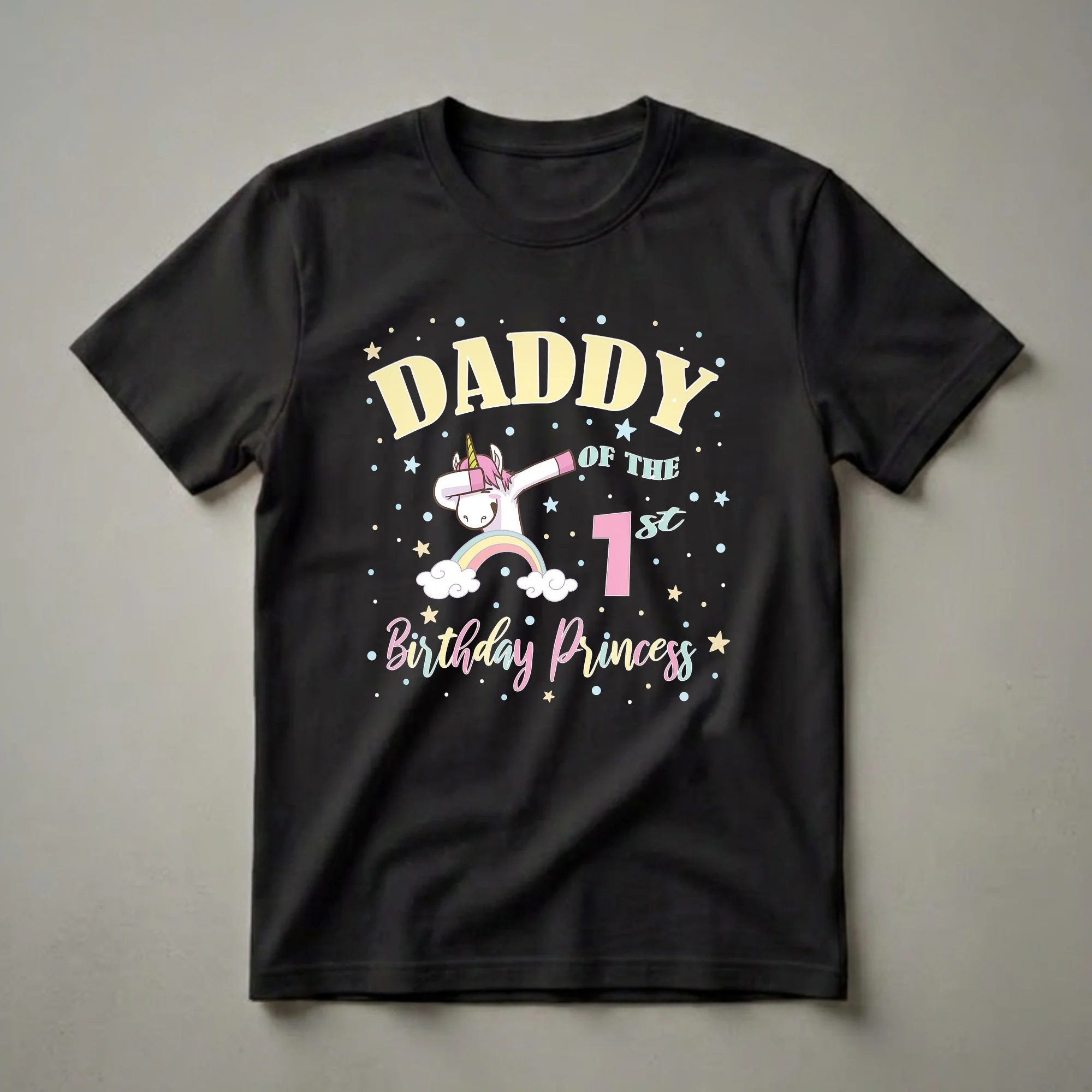 Black t-shirt featuring a cartoon unicorn dabbing, a rainbow, clouds, stars, and the text 'Daddy Of The 1st Birthday Princess'.