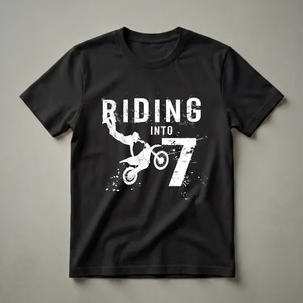 Black t-shirt with a white graphic of a motocross rider jumping, the words "RIDING INTO 7" and the number 7 in distressed white font.