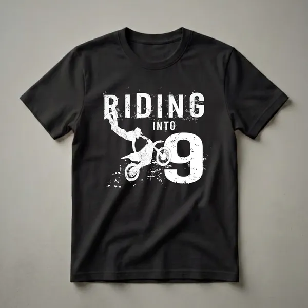 Black t-shirt with a white graphic that reads "RIDING INTO 9" featuring a motocross rider mid-air and distressed ink splatters.