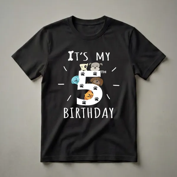 Black t-shirt with a large white number 5 decorated with paw prints and surrounded by cartoon dogs of various colors and breeds, celebrating a 5th birthday.
