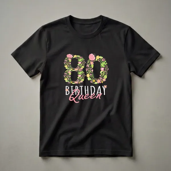 Black t-shirt with a floral design forming the number 80, with the words 'Birthday Queen' below it in pink and white script.