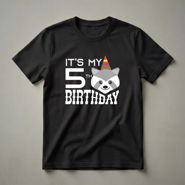 White graphic design on a black shirt that says 'IT'S MY 5TH BIRTHDAY' with a cartoon raccoon wearing a colorful party hat.
