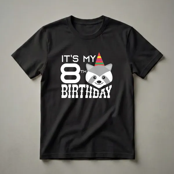White graphic t-shirt featuring the text 'IT'S MY 8TH BIRTHDAY' and a cartoon raccoon wearing a colorful party hat.