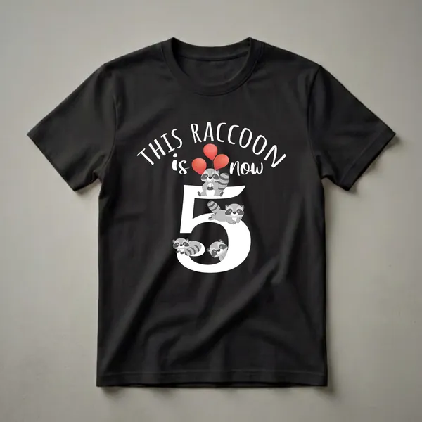 Black t-shirt featuring a large white number 5 with cartoon raccoons and red balloons, and white text that reads 'THIS RACCOON is now'.