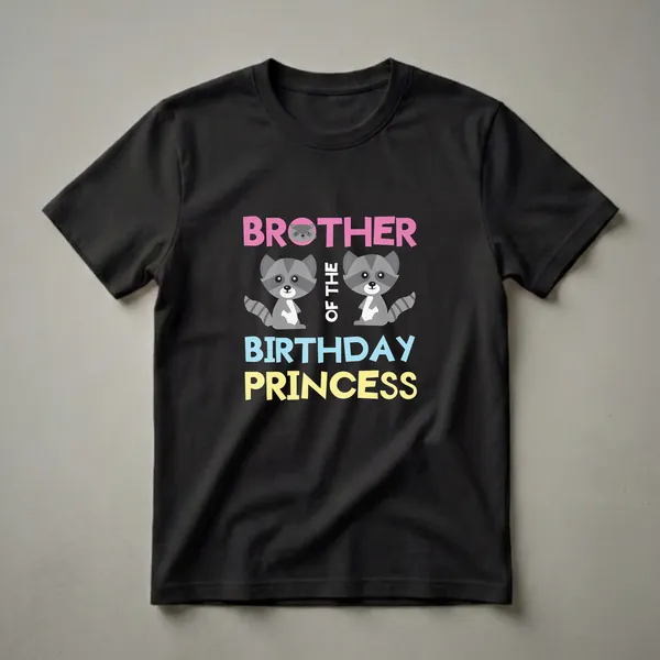 Black t-shirt with pink text 'BROTHER' and a small raccoon face, two cartoon raccoons, white text 'OF THE', and blue and yellow text 'BIRTHDAY PRINCESS'.