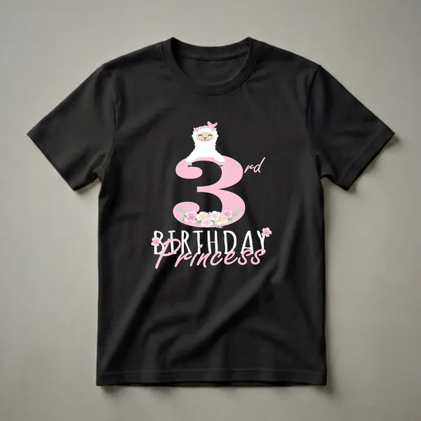 Pink graphic t-shirt featuring a white cartoon llama wearing a pink polka dot headband with flowers, sitting on a large pink number 3, with 'Birthday Princess' text below.