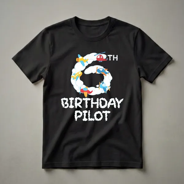 Black t-shirt featuring a cartoon graphic of a large number 6 made of clouds, surrounded by colorful airplanes and a helicopter, with the text "BIRTHDAY PILOT" below.