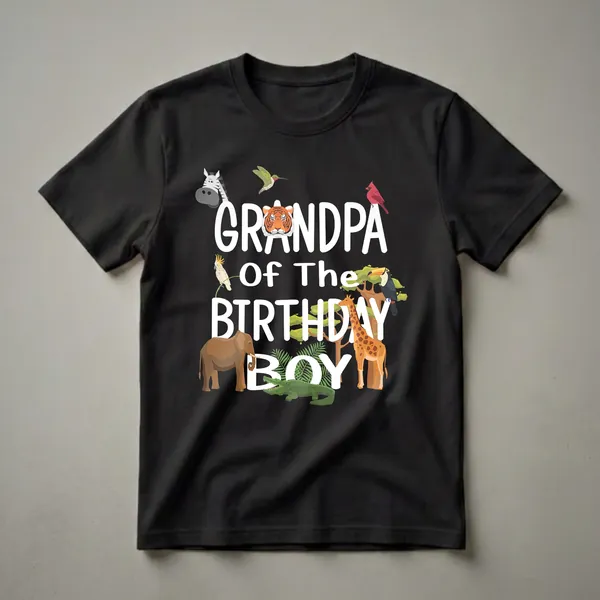 Black t-shirt with white text 'GRANDPA OF THE BIRTHDAY BOY' surrounded by cartoon zoo animals including a tiger, zebra, giraffe, elephant, toucan, and crocodile.